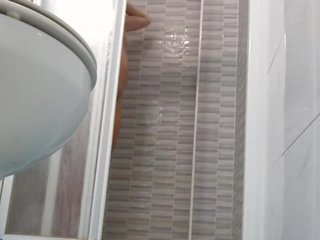 Spying on inviting Wife Shaving Pussy in Shower